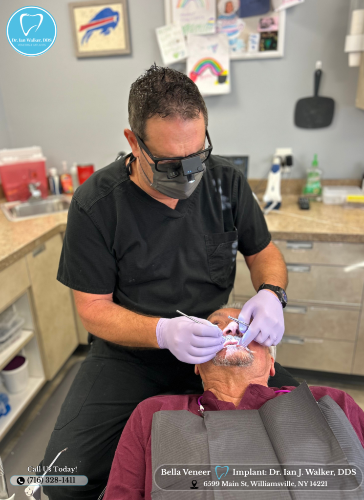 Dr. Ian J. Walker, DDS performing a dental exam